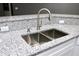 Kitchen sink with granite counter tops and a stainless steel faucet at 1508 W 16Th St, Sanford, FL 32771