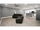 Open-concept living room leading into a modern kitchen with stainless appliances at 1508 W 16Th St, Sanford, FL 32771