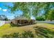 Large backyard with a screened-in porch, offering great outdoor living space at 15733 Switch Cane St, Clermont, FL 34711