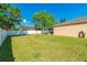 Well-maintained backyard featuring a white fence and a spacious grassy area at 15733 Switch Cane St, Clermont, FL 34711