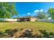 The oversized lot features a large grassy area, enclosed patio, and privacy fence at 15733 Switch Cane St, Clermont, FL 34711