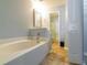 Relaxing bathroom features a large soaking tub and a separate shower area at 15733 Switch Cane St, Clermont, FL 34711