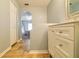 Hallway view to a bathroom with vanity and shower plus arched doorway to bedroom at 15733 Switch Cane St, Clermont, FL 34711