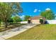 Charming home with a two-car garage, long driveway, and well-manicured lawn at 15733 Switch Cane St, Clermont, FL 34711