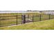 Backyard view of iron fence and gated access to lake at 16689 Broadwater Ave, Winter Garden, FL 34787