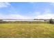 A spacious backyard features lake access and is surrounded by an iron fence at 16689 Broadwater Ave, Winter Garden, FL 34787