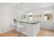 Stylish home bar featuring granite countertops, pendant lighting, and comfortable seating for entertaining guests at 16689 Broadwater Ave, Winter Garden, FL 34787
