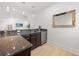 Stylish bar area features granite countertops, a sink, and a mini-fridge at 16689 Broadwater Ave, Winter Garden, FL 34787