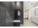 Modern bathroom features a shower with marble tile and a view of the bedroom at 16689 Broadwater Ave, Winter Garden, FL 34787