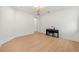 Bright room with wood floors, piano, and stylish ceiling fixture at 16689 Broadwater Ave, Winter Garden, FL 34787