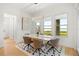 Bright dining area with large windows showcasing water views and modern decor at 16689 Broadwater Ave, Winter Garden, FL 34787