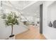 Bright foyer with hardwood floors and a glass-enclosed staircase at 16689 Broadwater Ave, Winter Garden, FL 34787