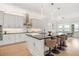 Modern kitchen features a large island with seating, sleek countertops, and stainless steel appliances at 16689 Broadwater Ave, Winter Garden, FL 34787