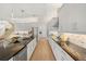 Extended gourmet kitchen design with large island, stainless steel appliances, and open floor plan at 16689 Broadwater Ave, Winter Garden, FL 34787