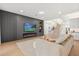 Comfortable living area with modern fireplace, large television, and open staircase at 16689 Broadwater Ave, Winter Garden, FL 34787