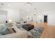 Bright and airy living room with modern furnishings, a rug, and hardwood floors at 16689 Broadwater Ave, Winter Garden, FL 34787
