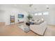 Cozy living room featuring modern furniture, a stylish rug, and a vaulted ceiling with natural light at 16689 Broadwater Ave, Winter Garden, FL 34787
