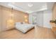 Bright, spacious primary bedroom suite with wood accent wall and en suite bathroom at 16689 Broadwater Ave, Winter Garden, FL 34787