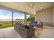 This covered outdoor patio features comfortable seating and offers stunning views of the water at 16689 Broadwater Ave, Winter Garden, FL 34787