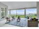 Patio with cozy seating area and scenic lake view at 16689 Broadwater Ave, Winter Garden, FL 34787