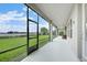 This covered patio boasts stunning water views and a screened-in enclosure for comfortable outdoor living at 16689 Broadwater Ave, Winter Garden, FL 34787