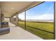 Spacious patio with beautiful views of the adjacent lake at 16689 Broadwater Ave, Winter Garden, FL 34787