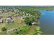 Waterfront home with private dock, lush greenery, and ample space near lake in a serene neighborhood at 16752 Caravaggio Loop, Montverde, FL 34756