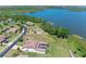 An aerial shot showcasing waterfront home in a neighborhood setting, close to a serene lake at 16752 Caravaggio Loop, Montverde, FL 34756