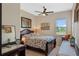 This light-filled bedroom has a ceiling fan and a large window at 16752 Caravaggio Loop, Montverde, FL 34756