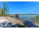Charming dock with shaded seating, ideal for enjoying waterfront views at 16752 Caravaggio Loop, Montverde, FL 34756