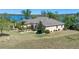 Sprawling single story home with beautiful landscaping and lake views at 16752 Caravaggio Loop, Montverde, FL 34756