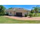 Three car garage with brick paver driveway and mature landscaping at 16752 Caravaggio Loop, Montverde, FL 34756