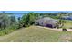 Exterior of home features landscaped yard, private drive and attached garage at 16752 Caravaggio Loop, Montverde, FL 34756