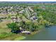 Waterfront property features a private dock, beach area, and lake access at 16752 Caravaggio Loop, Montverde, FL 34756