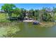 A covered boat dock along the lakeshore shows a waterfront oasis at 16752 Caravaggio Loop, Montverde, FL 34756