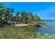 Lakeside area with dock, boat house, and beach at 16752 Caravaggio Loop, Montverde, FL 34756