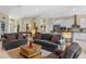 Spacious open-concept living area with a view of the kitchen and multiple seating options at 16752 Caravaggio Loop, Montverde, FL 34756