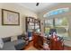 Office space with natural light and built-in shelving at 16752 Caravaggio Loop, Montverde, FL 34756
