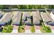 Aerial shot of the house highlighting well-maintained landscaping, brick driveways, and uniform street appeal at 17411 Million Lakes Ct, Clermont, FL 34714