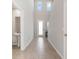 Inviting entryway with tile floors, soaring ceilings, and natural light creating a grand and welcoming entrance at 17411 Million Lakes Ct, Clermont, FL 34714