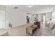 Open-concept living area seamlessly connects the kitchen, dining, and living spaces, creating an inviting atmosphere at 17411 Million Lakes Ct, Clermont, FL 34714