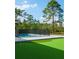 Backyard features a swimming pool and putting green at 18721 Seaview St, Orlando, FL 32833