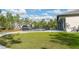 Backyard view featuring an in-ground pool, manicured lawn, and concrete patio at 18721 Seaview St, Orlando, FL 32833