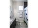 Well-lit bathroom with granite countertops, dark cabinets, and a Disney-themed shower curtain at 18721 Seaview St, Orlando, FL 32833