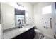 Bright bathroom featuring a granite countertop vanity and a shower with a cheerful Mickey Mouse themed curtain at 18721 Seaview St, Orlando, FL 32833