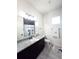 Stylish bathroom with granite countertops, dark cabinets, and Disney-themed decor at 18721 Seaview St, Orlando, FL 32833
