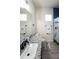 Bathroom featuring a granite countertop vanity and a shower with a cheerful Mickey Mouse themed curtain at 18721 Seaview St, Orlando, FL 32833