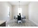 This dining room features a modern table with stylish chairs, bright lighting, and tile floors, creating an inviting atmosphere at 18721 Seaview St, Orlando, FL 32833