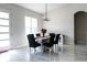 Bright dining room with modern chandelier and views of a backyard at 18721 Seaview St, Orlando, FL 32833