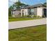 Attractive home exterior with gray stone accents and well-maintained lawn at 18721 Seaview St, Orlando, FL 32833